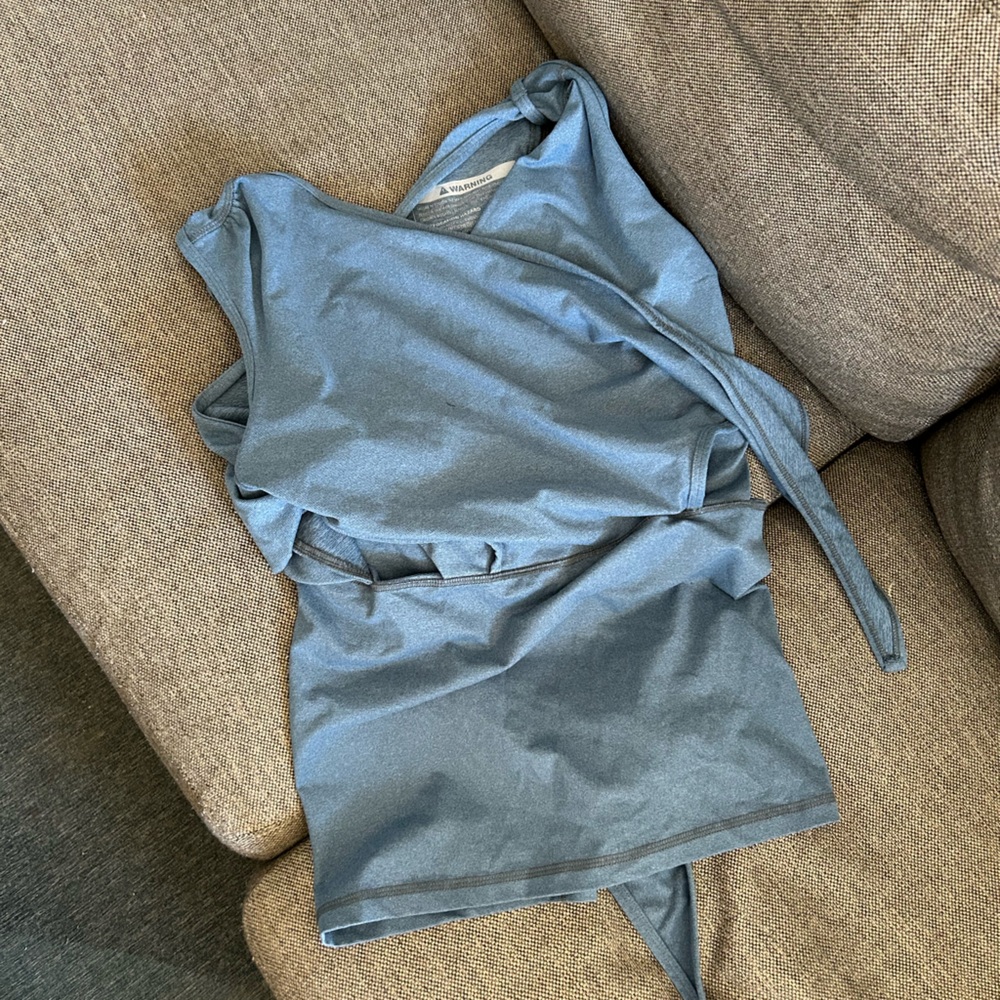 Nesting Days newborn baby wearing top